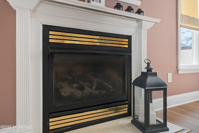 room details with a fireplace and baseboards