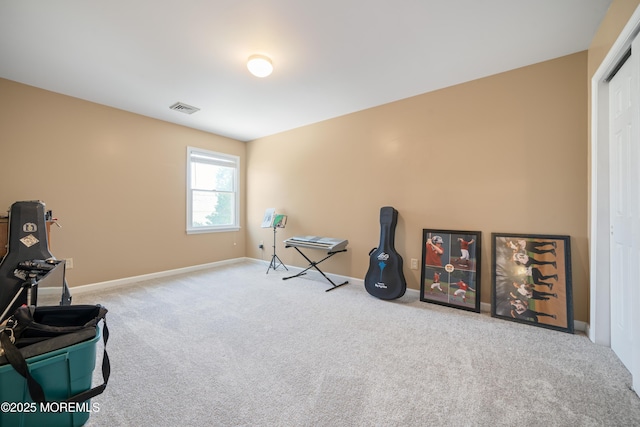 interior space with visible vents, baseboards, and carpet flooring