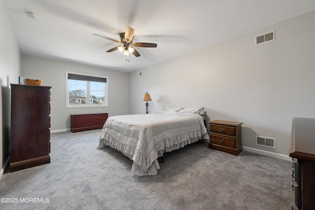 carpeted bedroom with visible vents, baseboards, and ceiling fan