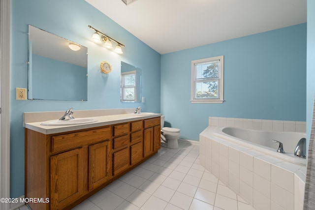 bathroom with a sink, toilet, a bath, and tile patterned flooring