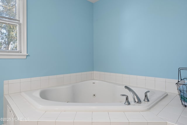 bathroom featuring a tub with jets