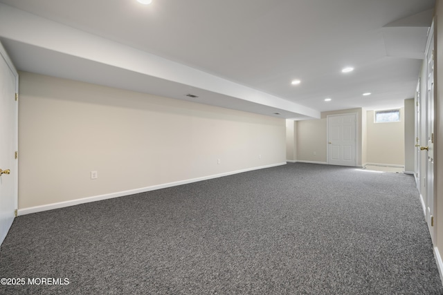 basement with visible vents, recessed lighting, baseboards, and carpet