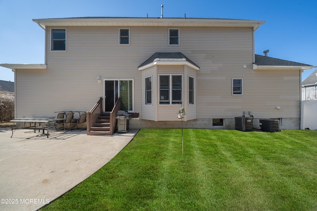 back of house with a yard, a patio, central AC unit, and entry steps