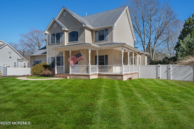 view of front of house featuring a gate, a porch, fence, a front yard, and a shingled roof