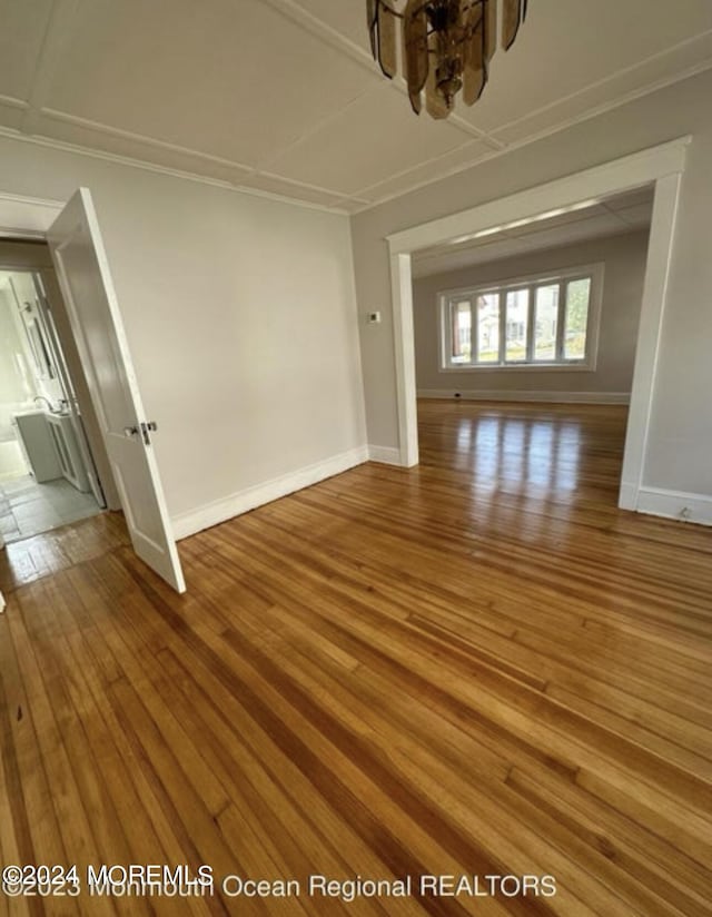 interior space featuring baseboards and wood-type flooring