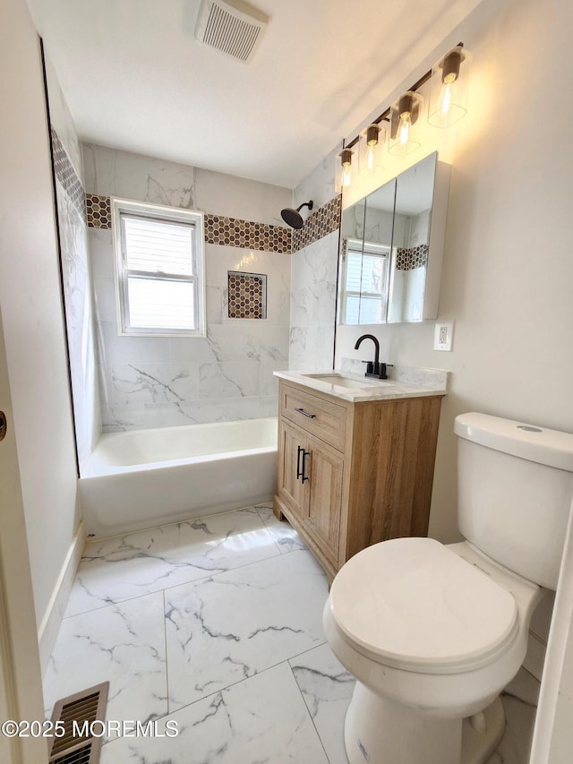 bathroom with visible vents, marble finish floor, toilet, and washtub / shower combination