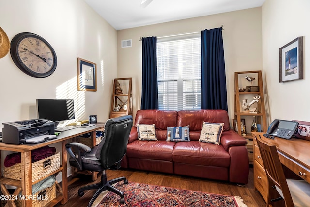 office area featuring visible vents and wood finished floors