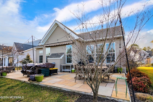 rear view of house with a patio