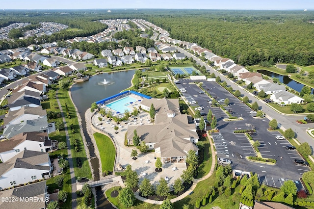 bird's eye view with a residential view and a water view