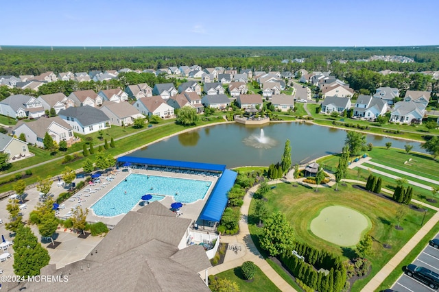 birds eye view of property featuring a residential view and a water view