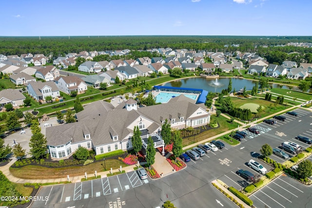 birds eye view of property featuring a water view and a residential view