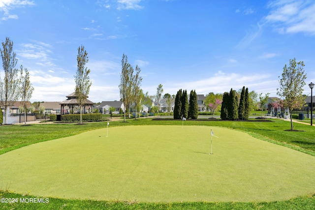 view of community with a gazebo, a residential view, and a lawn