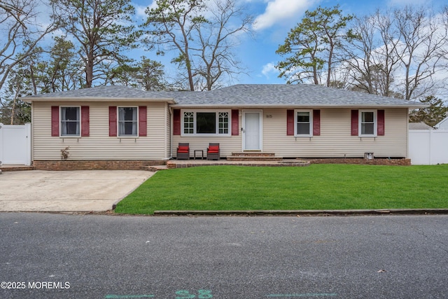 ranch-style house with a front lawn, fence, and roof with shingles