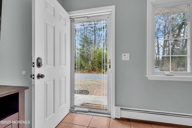 doorway to outside with tile patterned flooring and a baseboard radiator