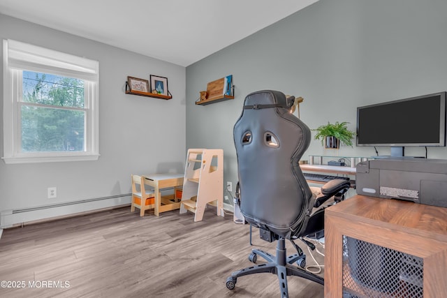 office space with wood finished floors and a baseboard radiator