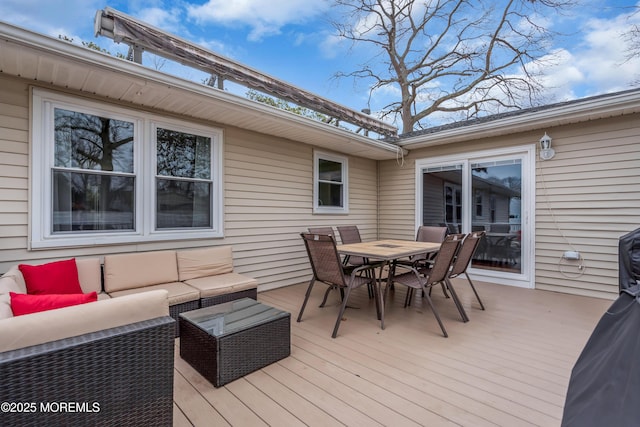 wooden terrace featuring an outdoor living space and outdoor dining space