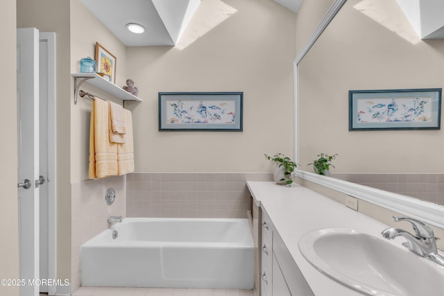 full bath with vanity and a garden tub