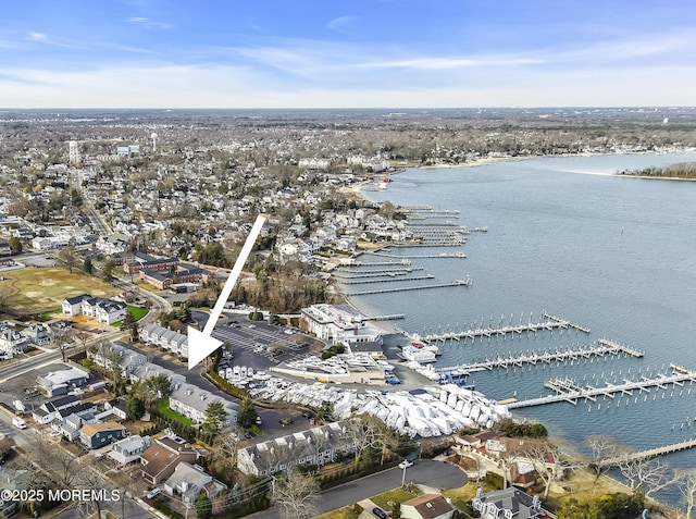 birds eye view of property featuring a water view