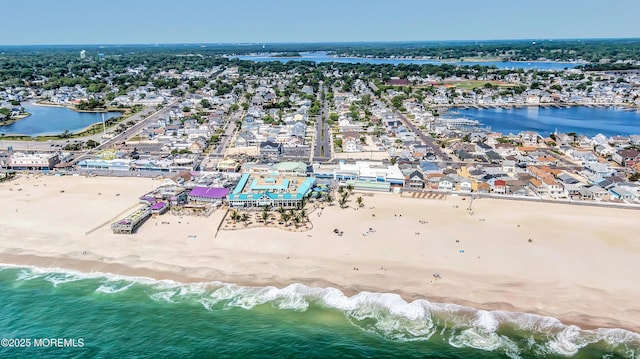 aerial view with a view of the beach and a water view