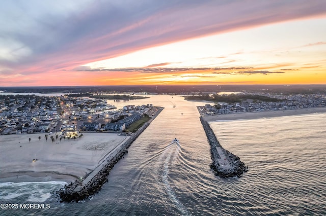 aerial view at dusk with a water view