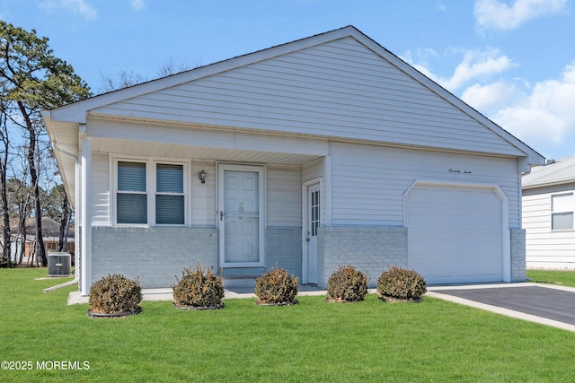 view of front facade with driveway, central AC, a front yard, a garage, and brick siding