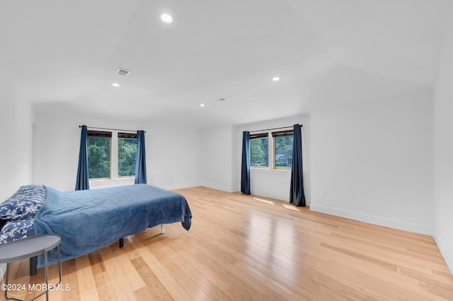 bedroom featuring visible vents, baseboards, vaulted ceiling, recessed lighting, and light wood-style flooring