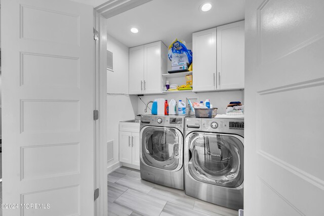 clothes washing area with washing machine and clothes dryer, recessed lighting, cabinet space, and visible vents