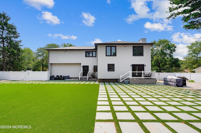 back of property with a patio, a gate, a fenced backyard, and stucco siding