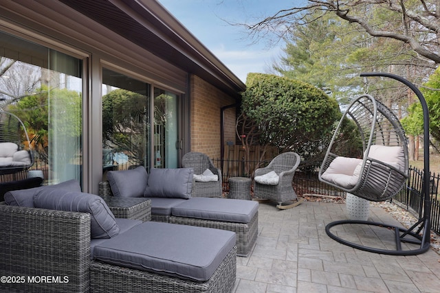 view of patio / terrace featuring an outdoor hangout area and fence