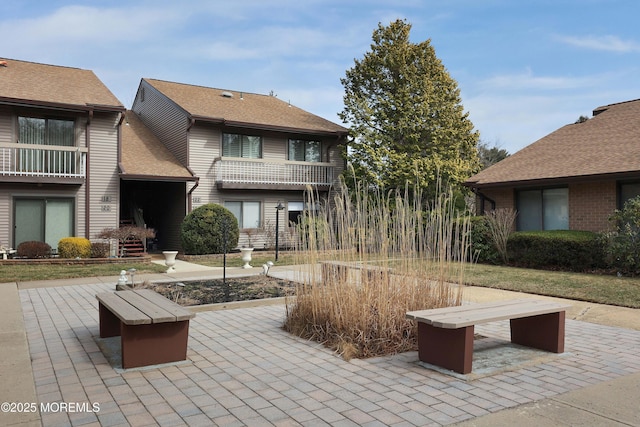 view of property's community with a patio area