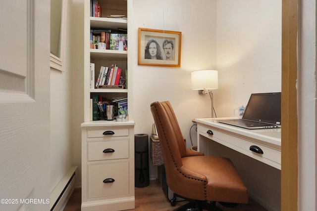 home office featuring wood finished floors and baseboard heating