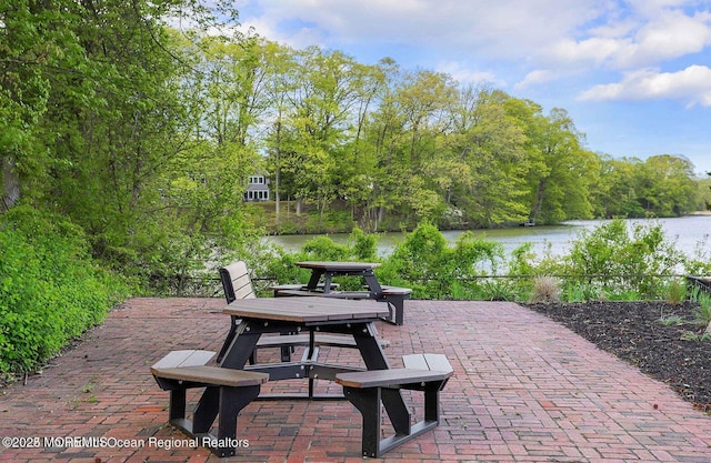 view of patio / terrace featuring a water view