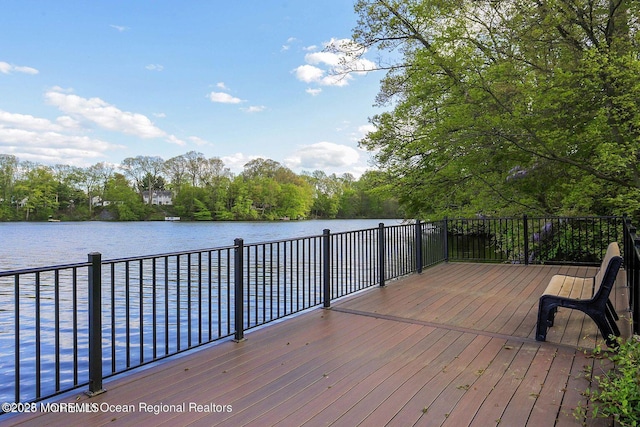 deck featuring a water view