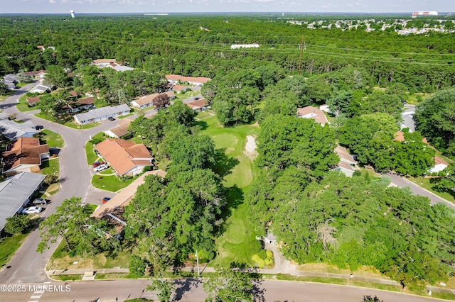 aerial view with a forest view and a residential view