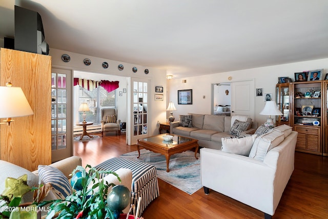 living room featuring a baseboard radiator and wood finished floors