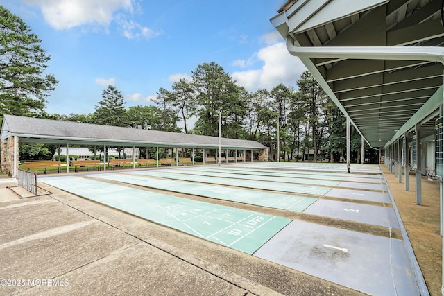 view of property's community featuring shuffleboard