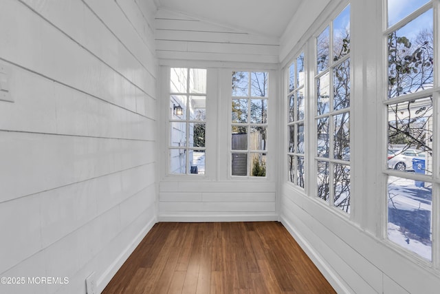 unfurnished sunroom featuring lofted ceiling