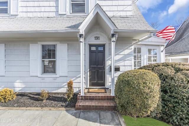 entrance to property featuring a high end roof