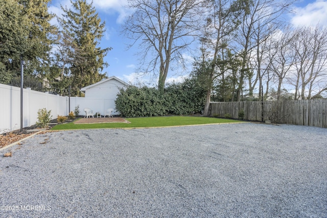 view of yard with a fenced backyard