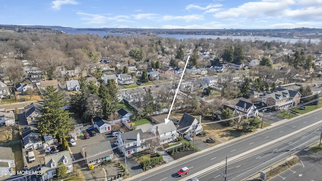 bird's eye view with a residential view and a water view