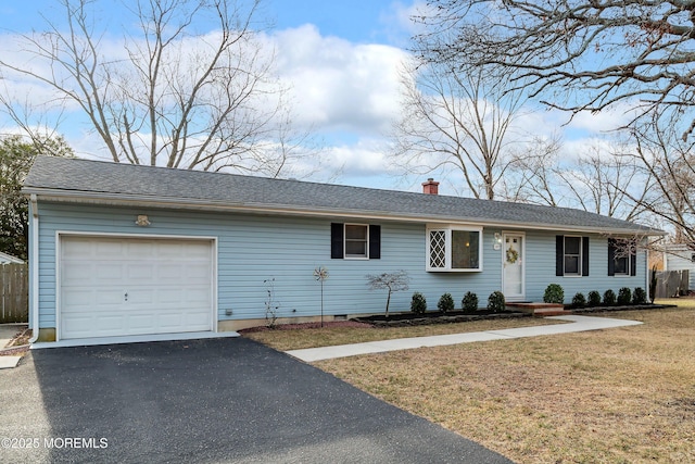 ranch-style home featuring a front yard, fence, driveway, an attached garage, and a chimney