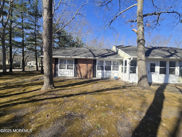 view of front of home with a sunroom