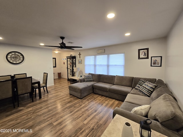 living room with a ceiling fan, recessed lighting, dark wood-style floors, and visible vents