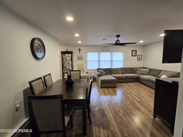 dining space with visible vents, a ceiling fan, wood finished floors, recessed lighting, and baseboard heating