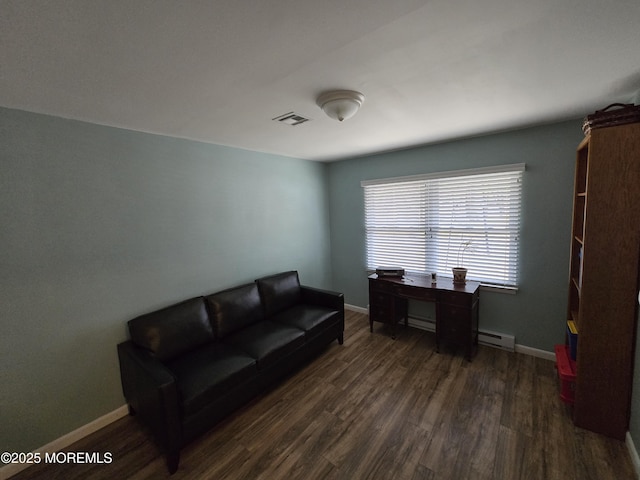 interior space featuring baseboards, dark wood-style floors, visible vents, and a baseboard radiator