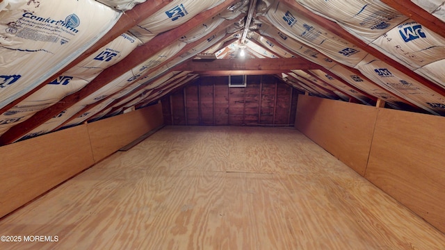 unfinished attic with water heater