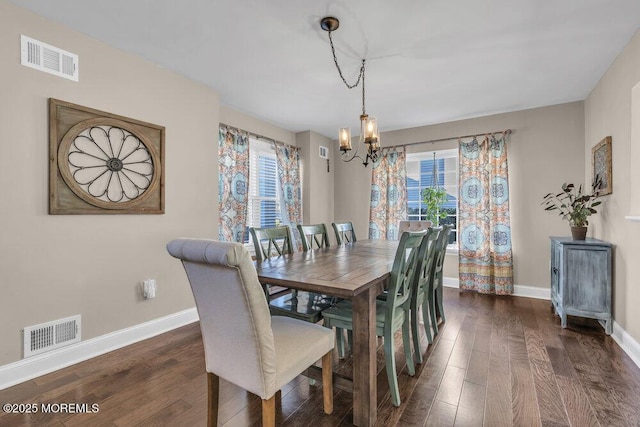 dining space with a chandelier, visible vents, baseboards, and dark wood-style flooring