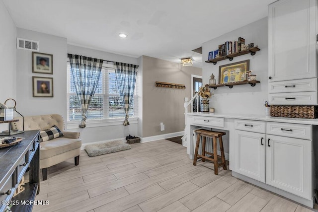 interior space with recessed lighting, visible vents, baseboards, and wood tiled floor