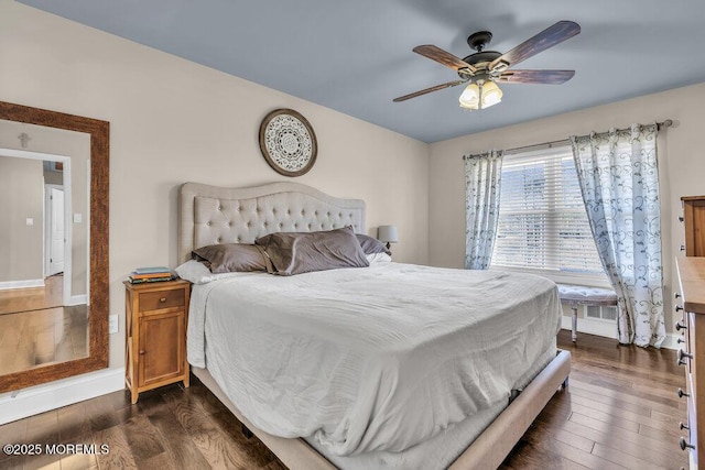 bedroom featuring dark wood-type flooring and baseboards