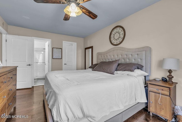 bedroom with dark wood finished floors, ceiling fan, and connected bathroom